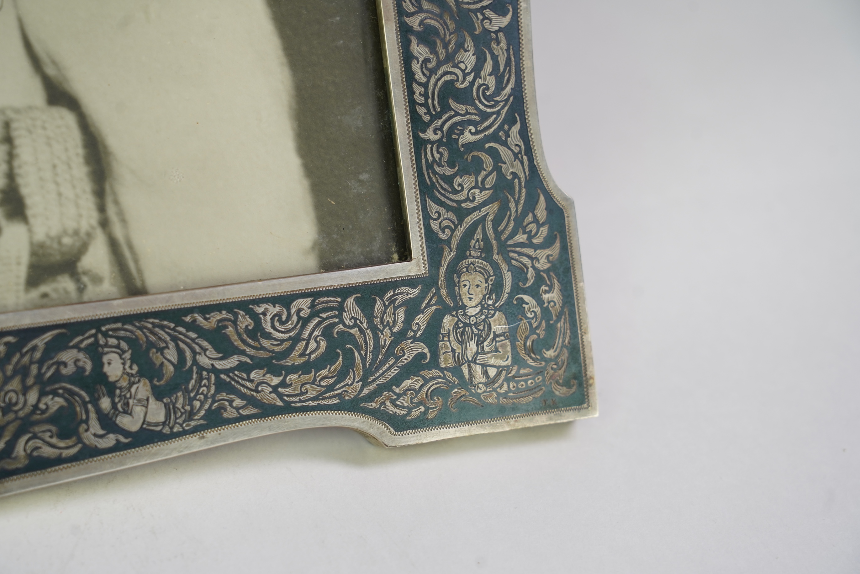 A large early 20th century Siamese silver and niello mounted rectangular photograph frame